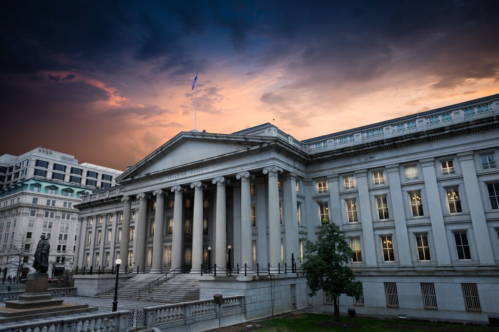 exterior of US Treasury building against storm clouds 1